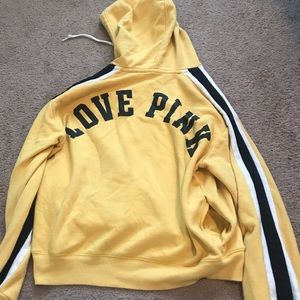 Yellow hoodie with black strips on the sides
